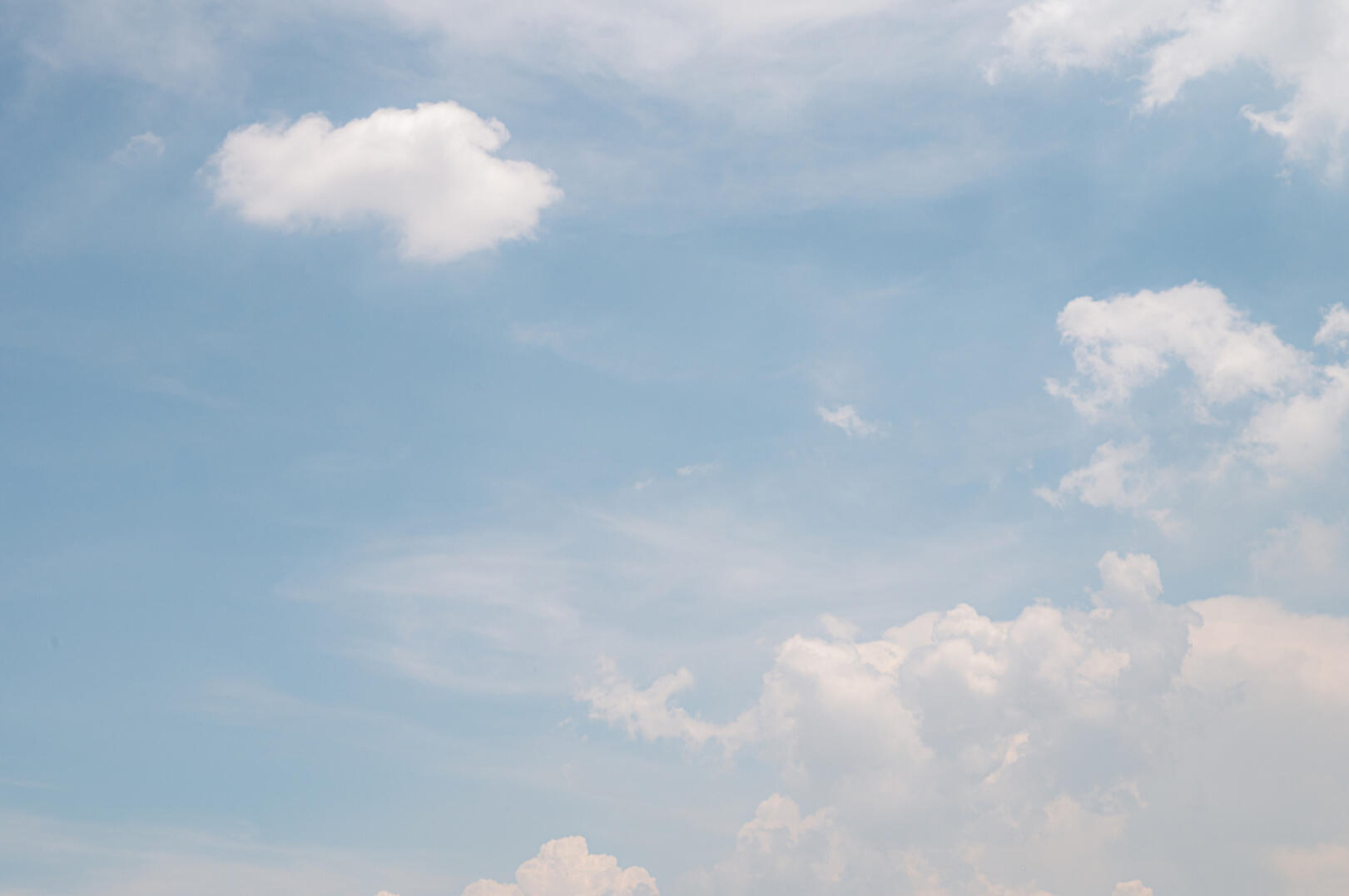 Blue sky and clouds representing clarity and a fresh perspective